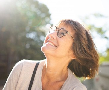 Lady smiles at sky