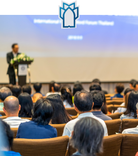Lecturer giving a presentation in an auditorium